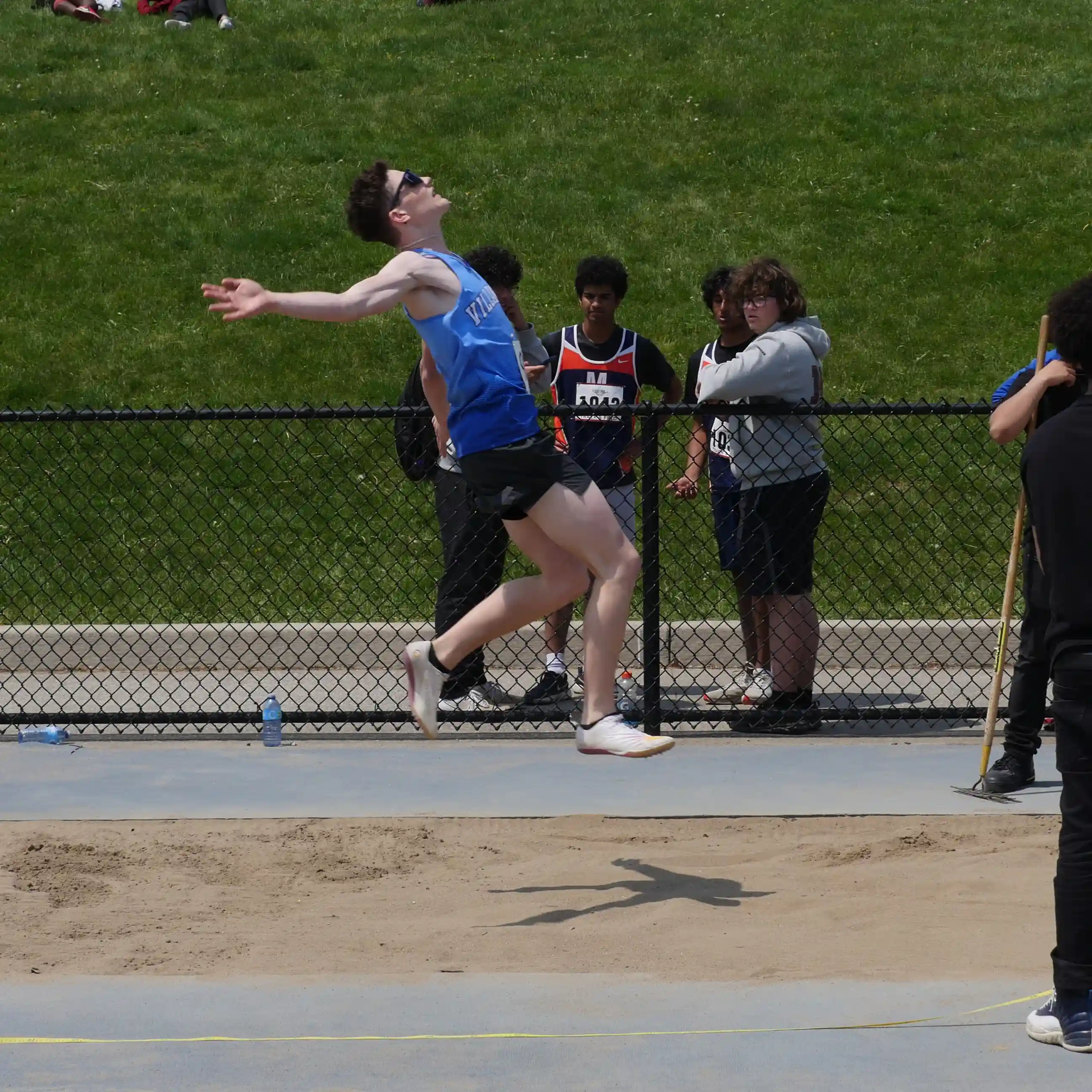track and field long jumper, mid jump